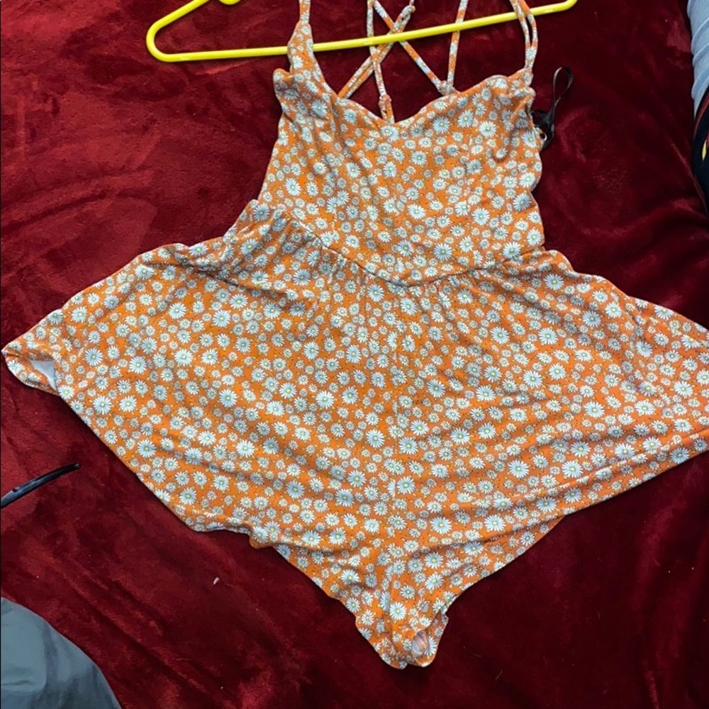 Orange romper with daisies